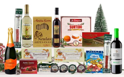 Lot nadalenc amb cava, vi blanc, vi negre, neules artesanes, torrons variats, galetes assortides, bombons, patés, llaminadures i embotit, presentat com a cistella de regal de Nadal.