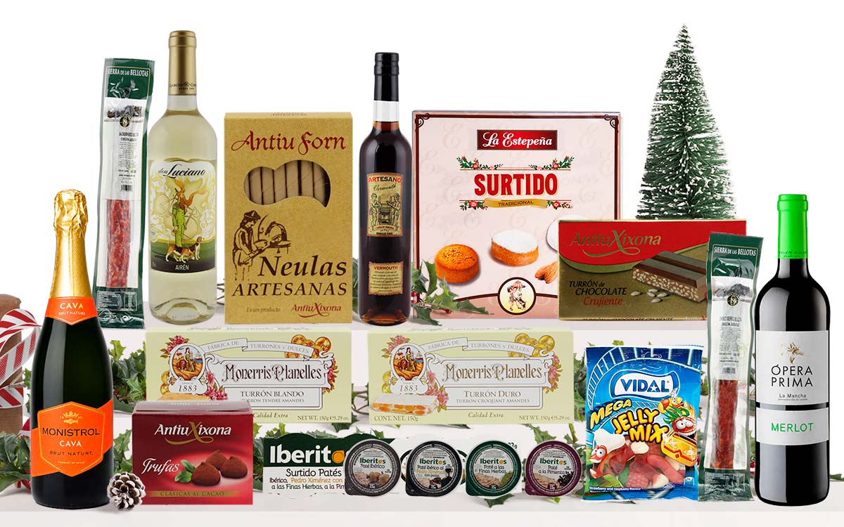 Lot nadalenc amb cava, vi blanc, vi negre, neules artesanes, torrons variats, galetes assortides, bombons, patés, llaminadures i embotit, presentat com a cistella de regal de Nadal.