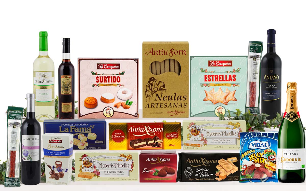 Lot nadalenc amb cava, vi blanc, vi negre, neules artesanes, torrons variats, galetes assortides, bombons, llaminadures, embotit i crema per untar, presentat com a regal de Nadal.