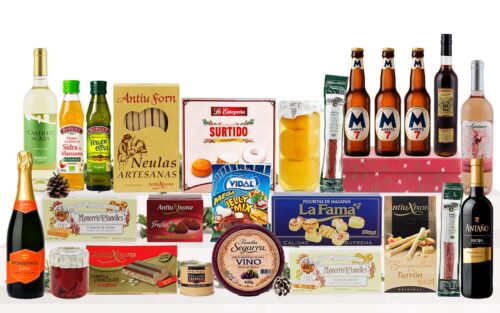 Lot nadalenc amb cava, vi blanc, vi negre, neules artesanes, torrons variats, galetes assortides, bombons, llaminadures, embotit i crema per untar, presentat com a regal de Nadal.