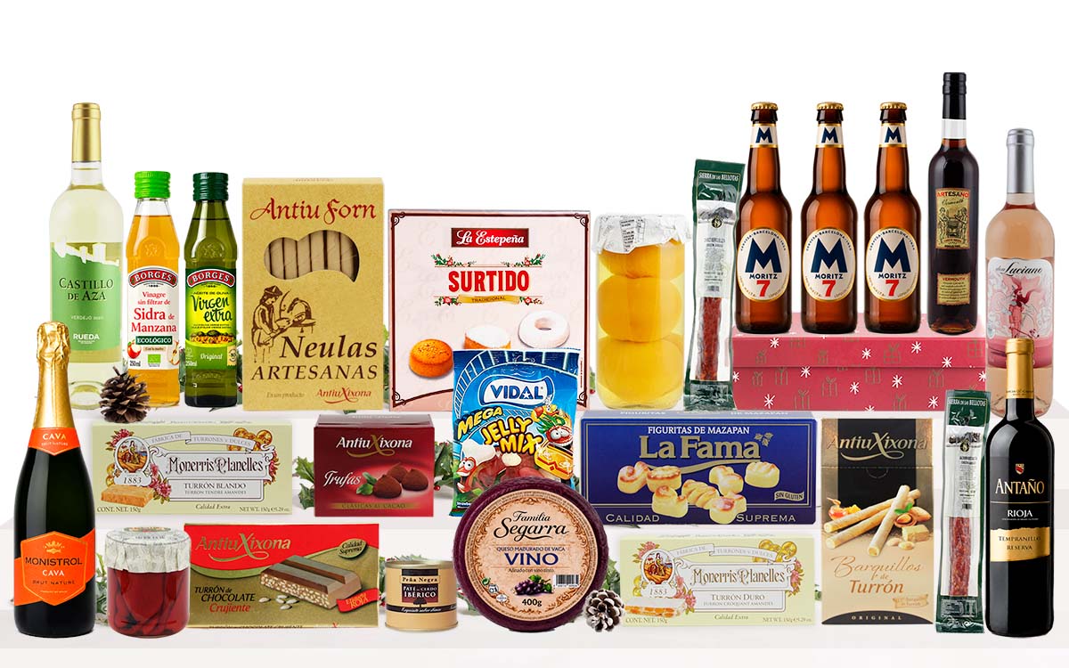 Lot nadalenc amb cava, vi blanc, vi negre, neules artesanes, torrons variats, galetes assortides, bombons, llaminadures, embotit i crema per untar, presentat com a regal de Nadal.