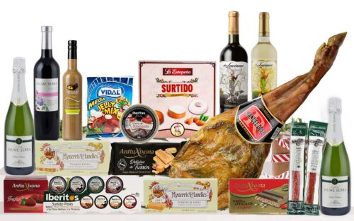 Lot nadalenc premium amb espatlla curada, cava, vins, vermut, patés, torrons, neules, embotits, llaminadures i dolços tradicionals, presentat com a regal de Nadal.