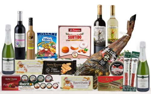Lot nadalenc premium amb espatlla curada, cava, vins, vermut, patés, torrons, neules, embotits, llaminadures i dolços tradicionals, presentat com a regal de Nadal.