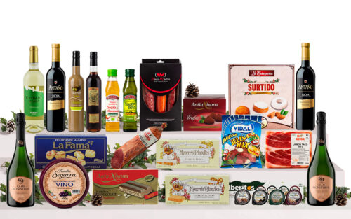 Lot nadalenc gourmet amb caves, vins, licor de xocolata i festuc, vermut, oli d'oliva, vinagre ecològic, embotits ibèrics, formatge, patés, torrons, massapà, dolços tradicionals i llaminadures, presentat en una caixa de cartró decorada.
