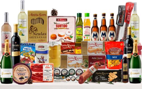 Lot nadalenc gourmet amb cava, vins, vermut, cervesa, oli d'oliva, vinagre ecològic, formatge, embotits ibèrics, fruits secs, préssecs en almívar, torrons, neules, trufes, bombons, dolços tradicionals i llaminadures, presentat en una caixa de cartró decorada amb nansa.