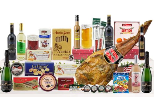 Lot nadalenc premium amb espatlla curada, cava, vins, licor de xocolata i festuc, vermut, formatge, embotits ibèrics, patés, pebrots del piquillo, préssecs en almívar, torrons, neules, bombons, massapà, dolços tradicionals i llaminadures, presentat en una caixa de cartró decorada amb nansa.