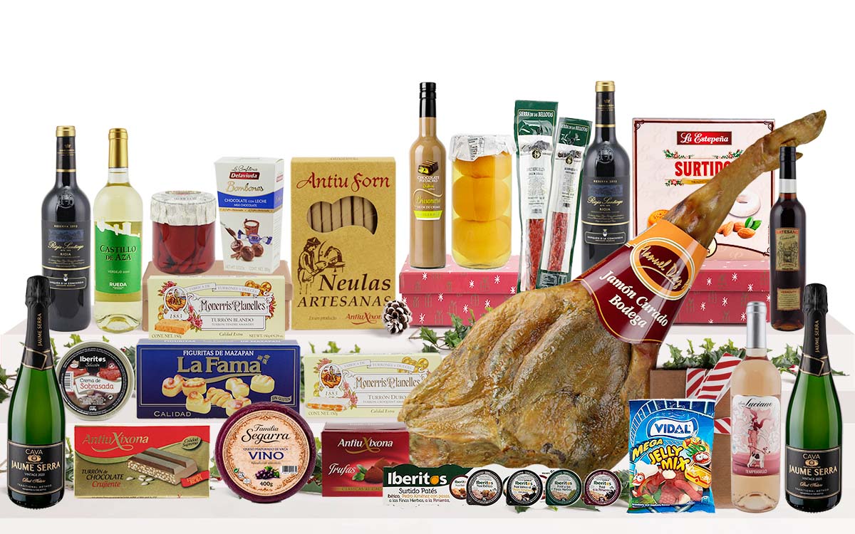 Lot gurmet de Nadal amb pernil de Cantimpalos, caves, vins, licors, embotits ibèrics, formatge, conserves, torrons, dolços tradicionals, bombons, neules, llaminadures i caixa decorativa amb nansa.