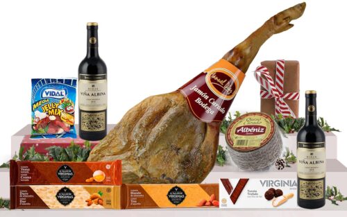 Lot gurmet de Nadal amb pernil bodega gras de Cantimpalos, vi Gran Reserva, assortiment d'ibèrics, formatge curat, torrons artesans i caixa decorada amb nansa.