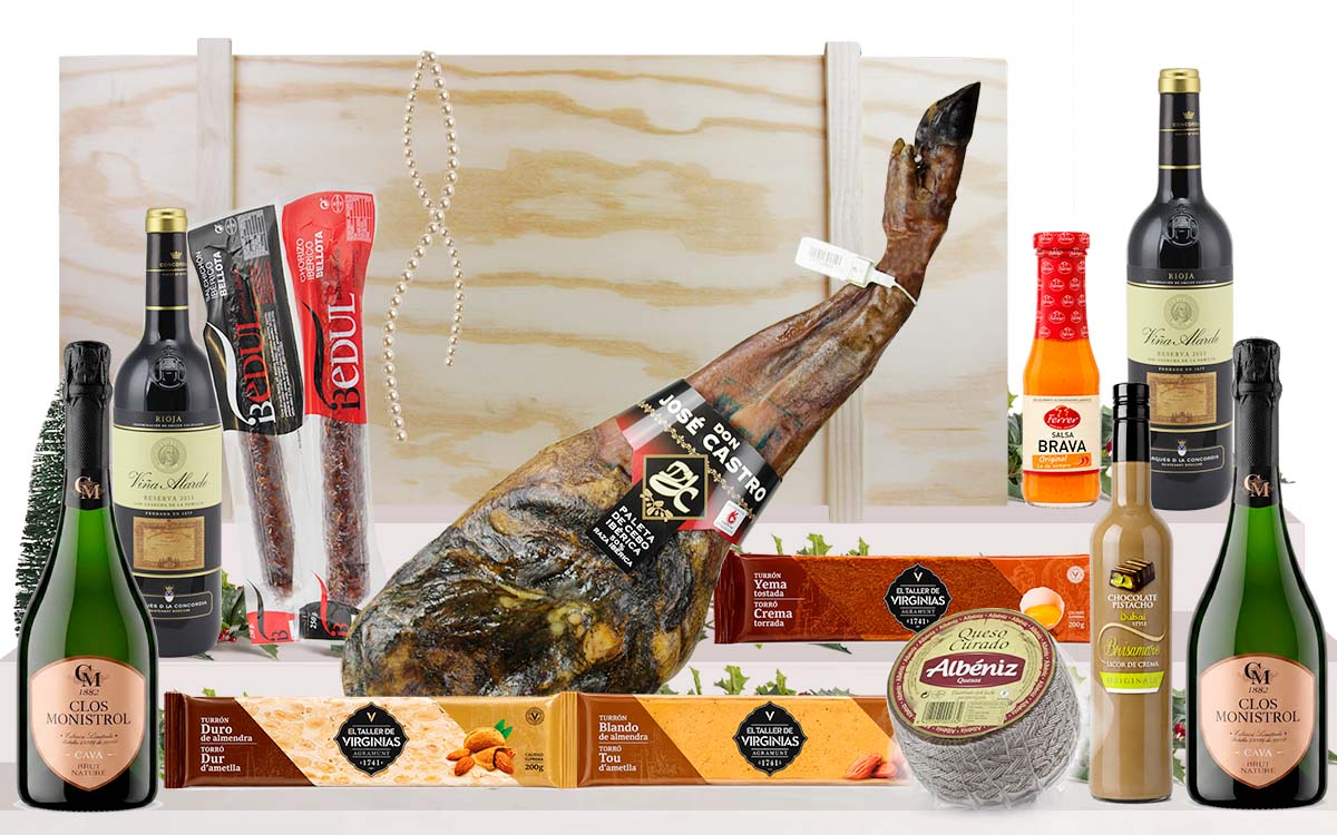 Lot gourmet amb paleta ibèrica de cebo de Salamanca, cava, vins, embotits ibèrics, formatge, torrons i licor, presentat en una caixa jamonera de fusta.