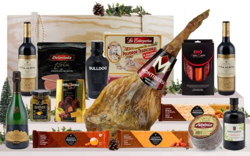 Lot gourmet amb pernil Bodega Gran Reserva de Cantimpalos, cava, vi de Rioja, ginebra premium, oli d’oliva verge extra, ibèrics, formatge, torrons i dolços, presentat en una caixa jamonera de fusta.