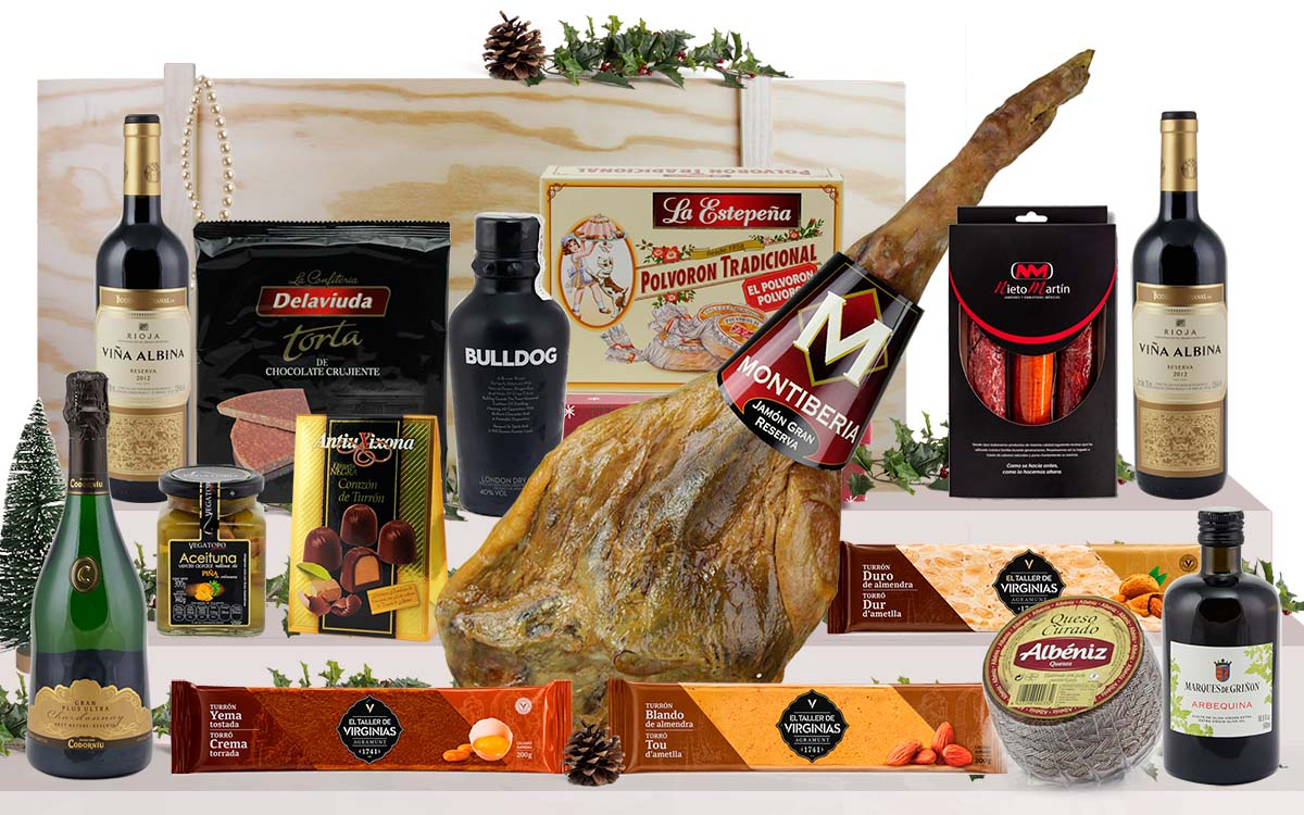 Lot gourmet amb pernil Bodega Gran Reserva de Cantimpalos, cava, vi de Rioja, ginebra premium, oli d’oliva verge extra, ibèrics, formatge, torrons i dolços, presentat en una caixa jamonera de fusta.