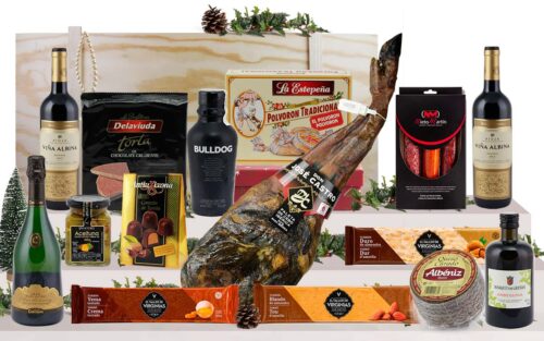 Lot gourmet amb paleta ibèrica de cebo de Salamanca, cava, vi de Rioja, ginebra premium, oli d’oliva verge extra, ibèrics, formatge, torrons i dolços, presentat en una caixa jamonera de fusta.