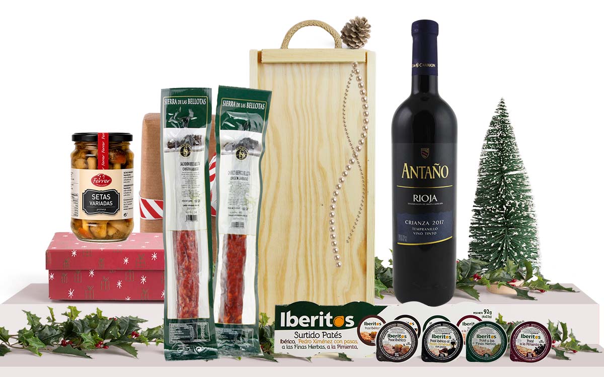 Lot gourmet amb vi negre Rioja Criança, xoriço i salxitxó ibèrics de gla, assortiment de patés ibèrics, bolets variats, presentat en una caixa de fusta amb nansa.